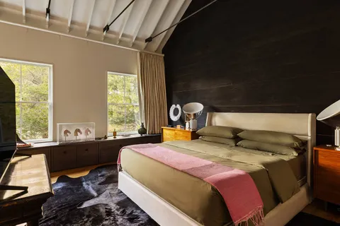 a bedroom with a bed and window