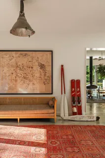 a view of a living room with furniture and wooden floor