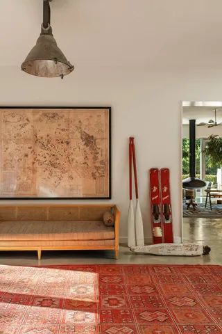 a view of a living room with furniture and wooden floor