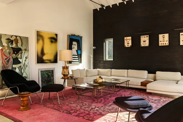 a living room with furniture and a rug