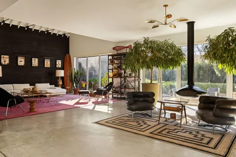 a view of a patio with swimming pool table and chairs