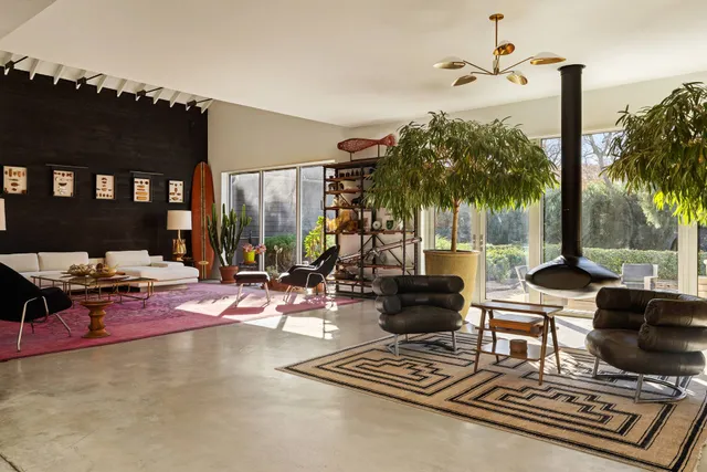 a view of a patio with swimming pool table and chairs