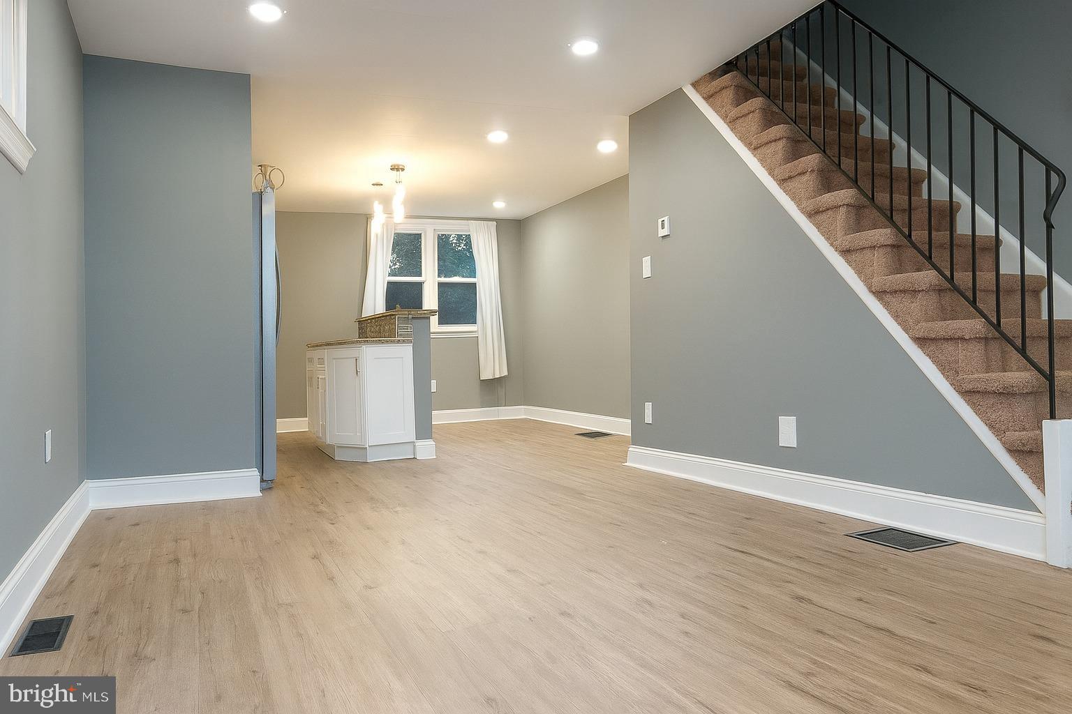 29 Concord Road Darby, PA 19023 - Photo 4 of 21 a view of an empty room with wooden floor and staircase