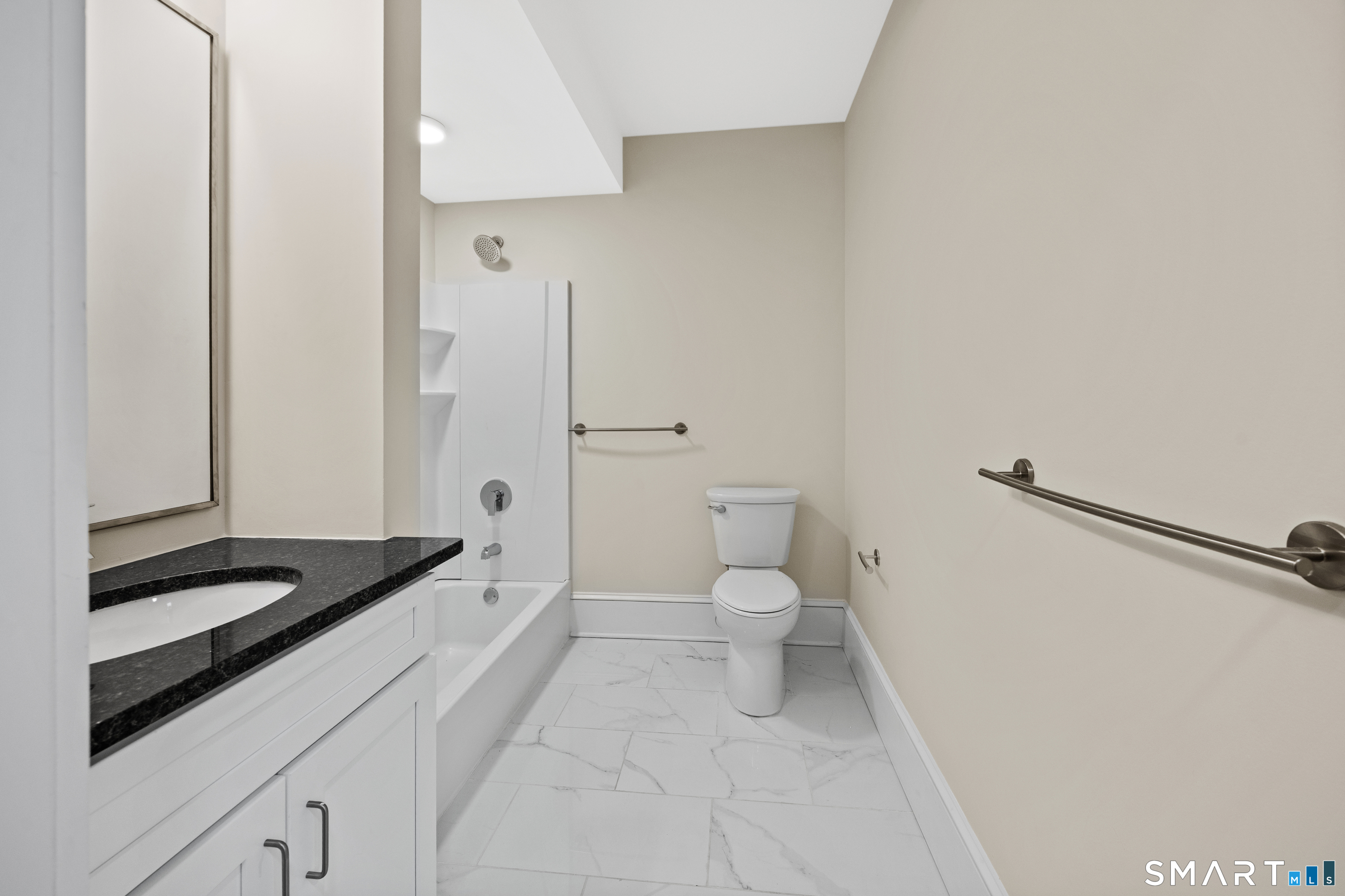 1355 Main Street, Unit 405 Hartford, CT 06103 - Photo 8 of 11 a spacious bathroom with a granite countertop sink a toilet and a shower
