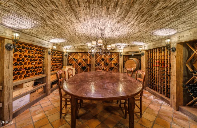 a room with lots of furniture and wooden floors