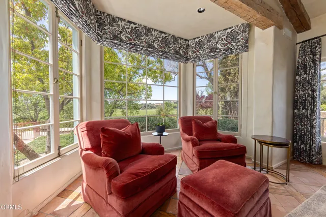 a spacious bedroom with a bed and a dresser