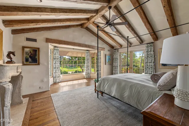a bathroom with a granite countertop sink toilet and mirror