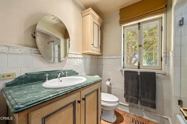 a house view with a sitting space and garden space