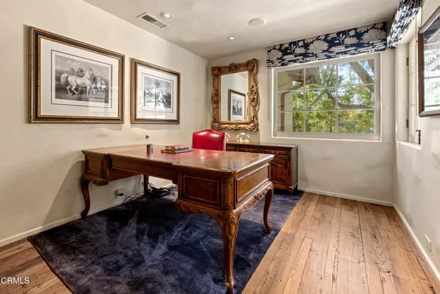 front view of a house with a fountain