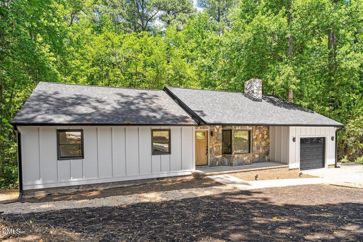 1712 Rosedale Avenue Durham, NC 27707 - Photo 3 of 39 a house with trees in the background