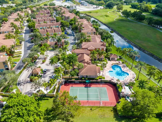 a view of a lake with houses in the back