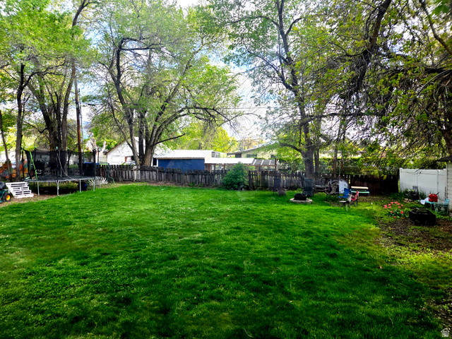 142 West 400 North Logan, UT 84321 - Photo 34 of 35 Expansive green lawn providing ample outdoor space