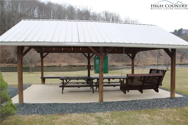 a view of swimming pool with outdoor seating