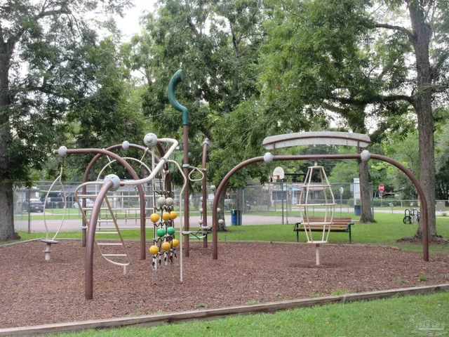 a view of a park with swings