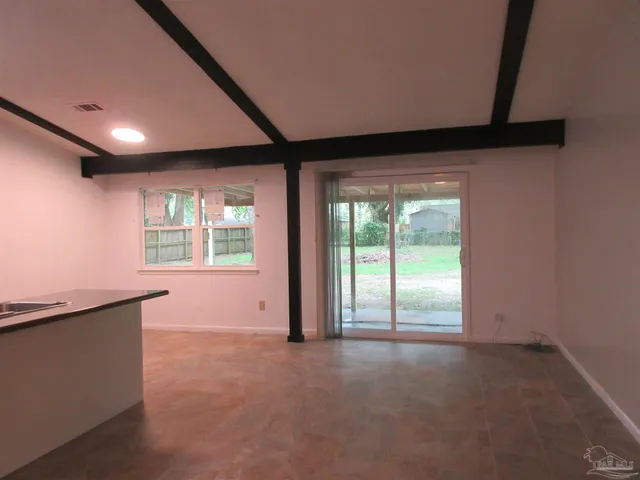 an empty room with windows