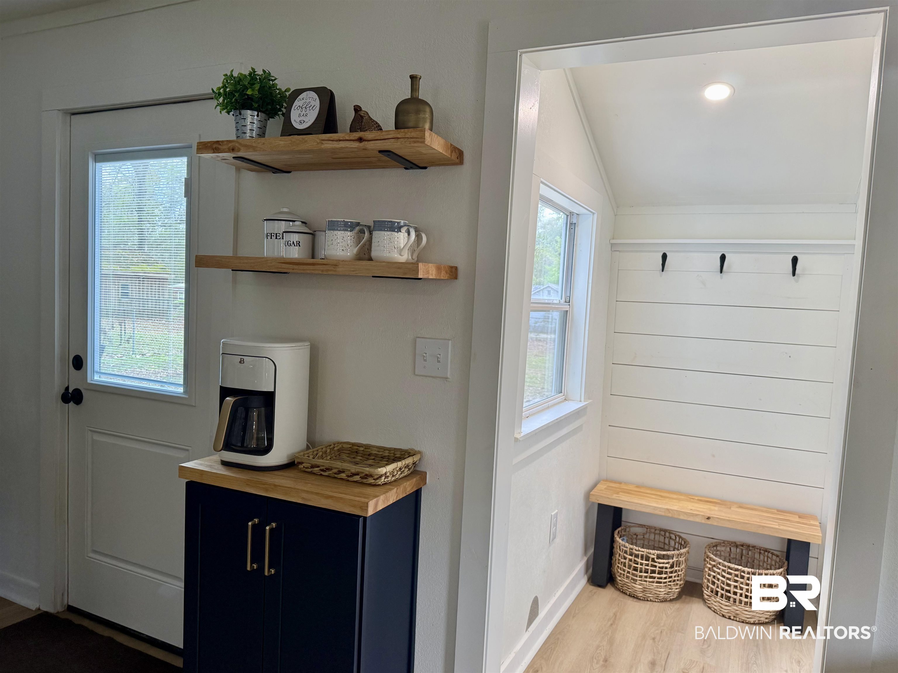 107 Dawson Street Brewton, AL 36426 - Photo 9 of 15 Mudroom with lofted ceiling, light wood-style flooring, and healthy amount of natural light