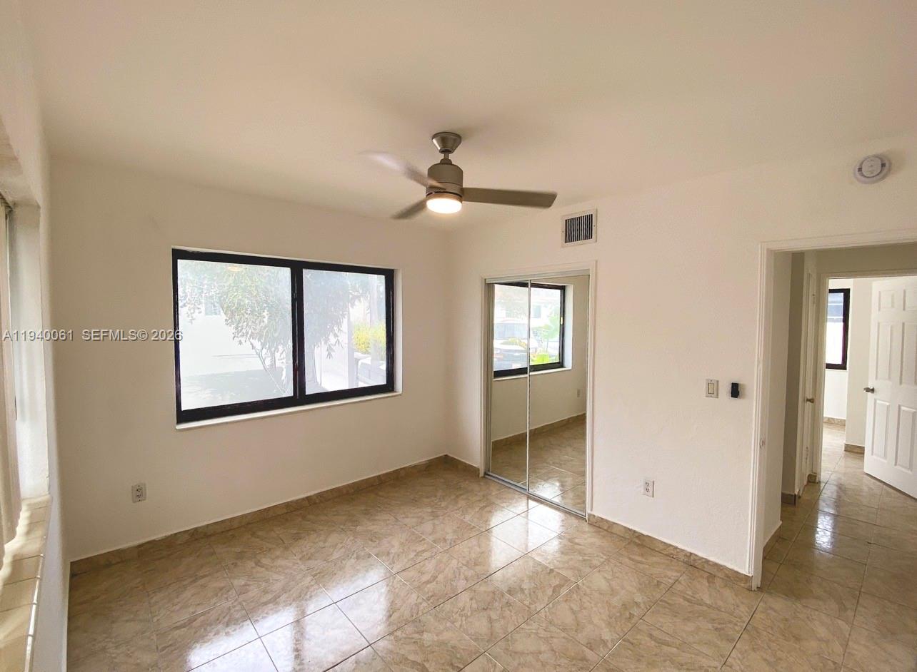 650 83rd Street, Unit 3 Miami Beach, FL 33141 - Photo 21 of 23 a view of an empty room with a window