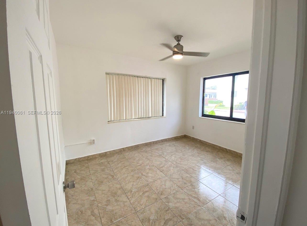 650 83rd Street, Unit 3 Miami Beach, FL 33141 - Photo 22 of 23 a view of an empty room with a window
