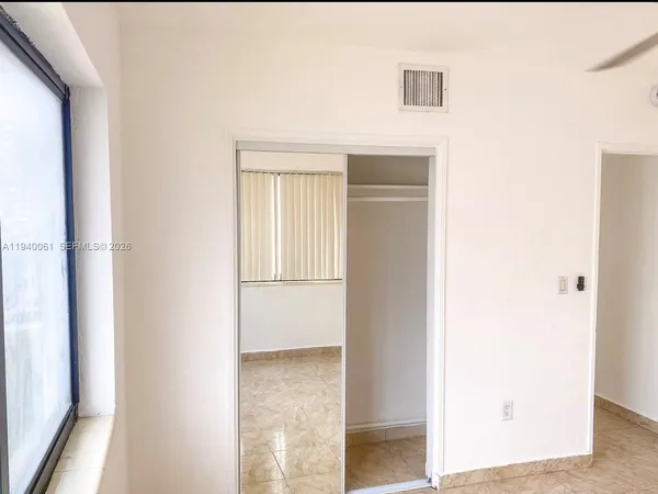 a view of a room that has a window in it