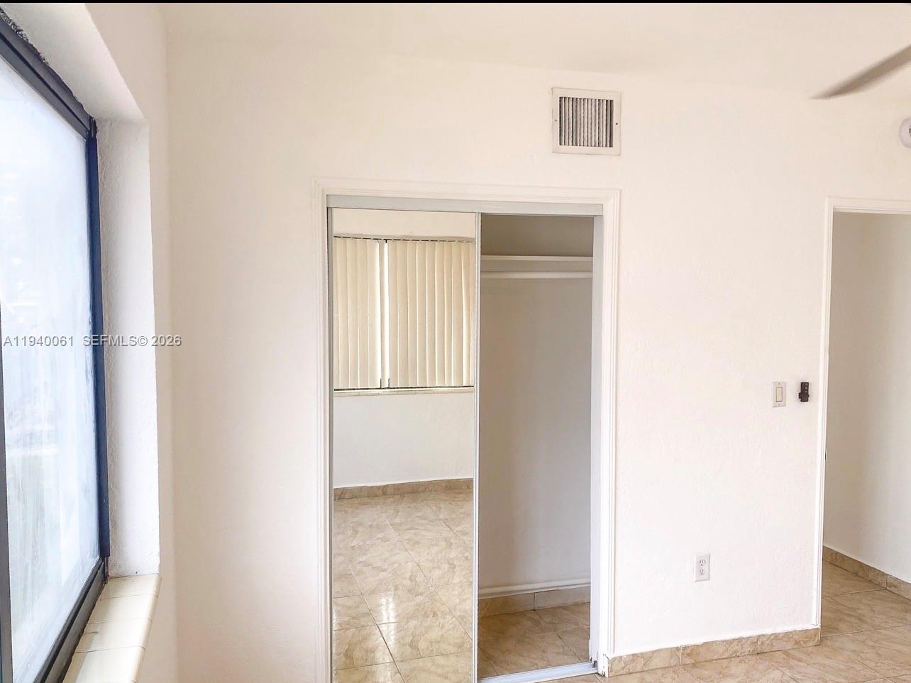 650 83rd Street, Unit 3 Miami Beach, FL 33141 - Photo 23 of 23 a view of a room that has a window in it