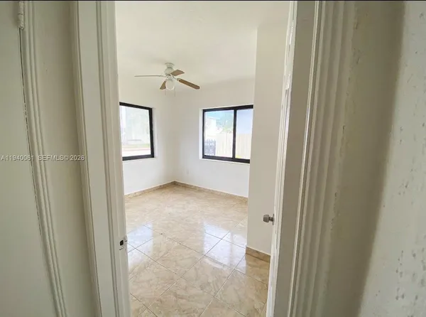 a view of a bathroom with a sink and a mirror