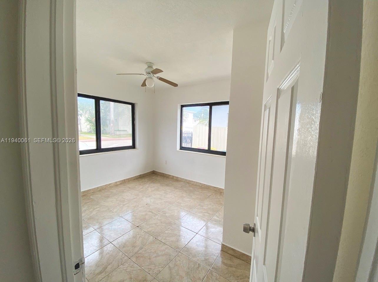 650 83rd Street, Unit 3 Miami Beach, FL 33141 - Photo 9 of 23 a view of an empty room with windows and closet
