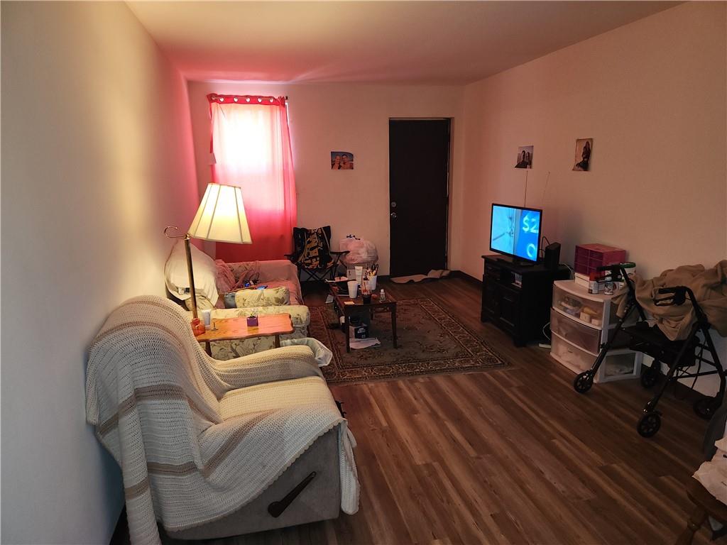 300 Helen Street McKees Rocks, PA 15136 - Photo 15 of 48 a living room with furniture a lamp and wooden floor