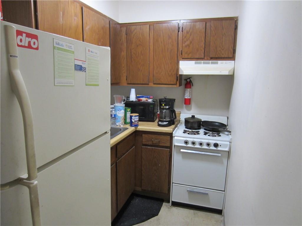 300 Helen Street McKees Rocks, PA 15136 - Photo 17 of 48 a kitchen with a refrigerator and a stove