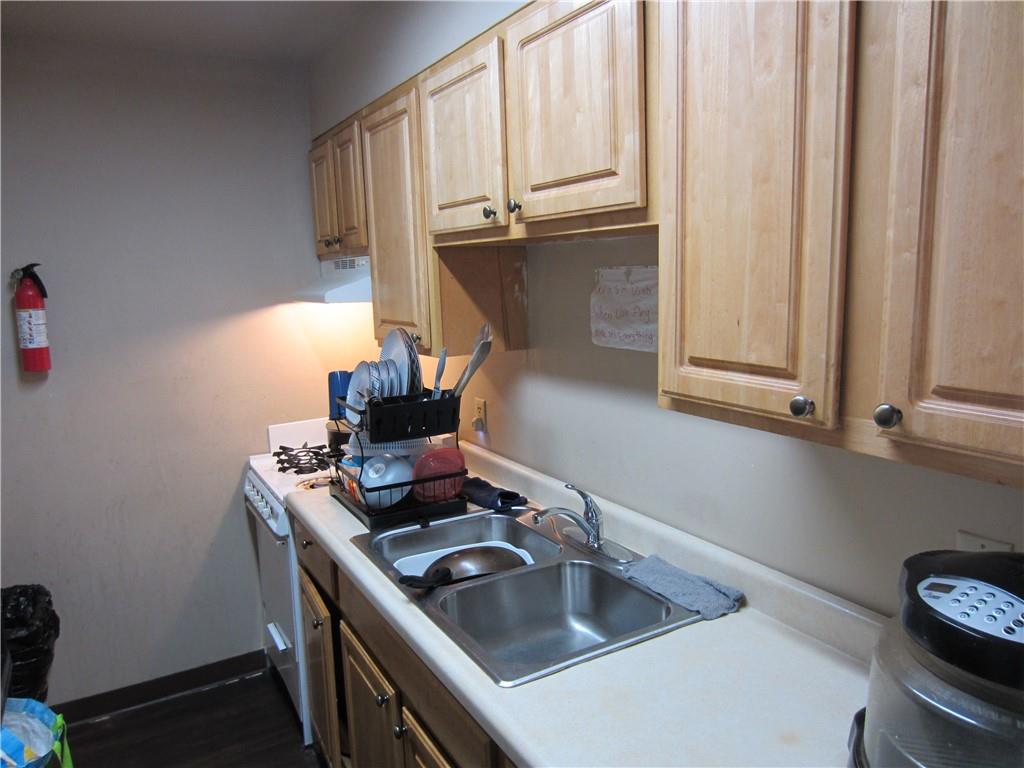 300 Helen Street McKees Rocks, PA 15136 - Photo 19 of 48 a kitchen with a sink cabinets and a stove top oven