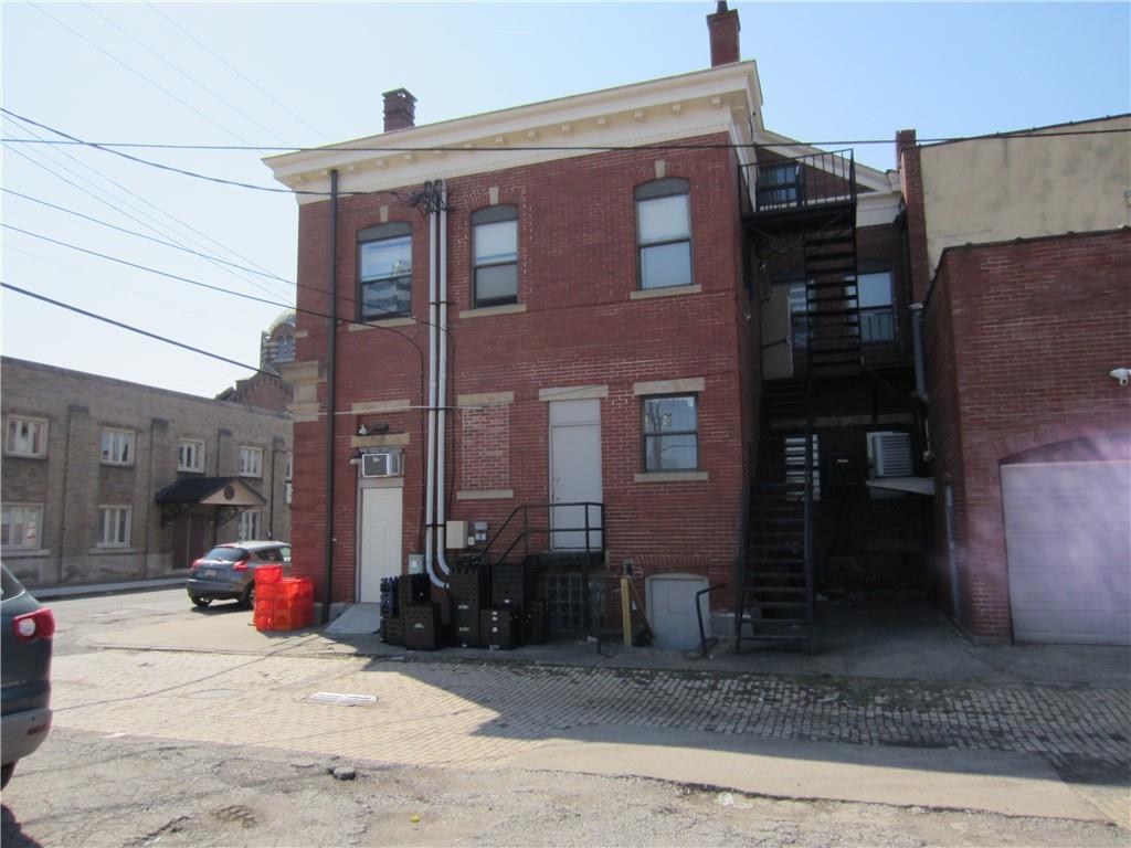 300 Helen Street McKees Rocks, PA 15136 - Photo 47 of 48 a view of a brick building next to a yard