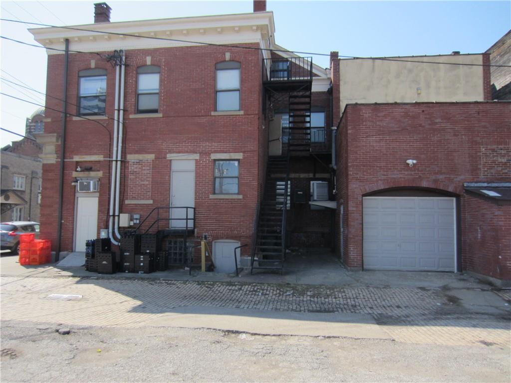 300 Helen Street McKees Rocks, PA 15136 - Photo 5 of 48 a view of a house with a patio and a yard