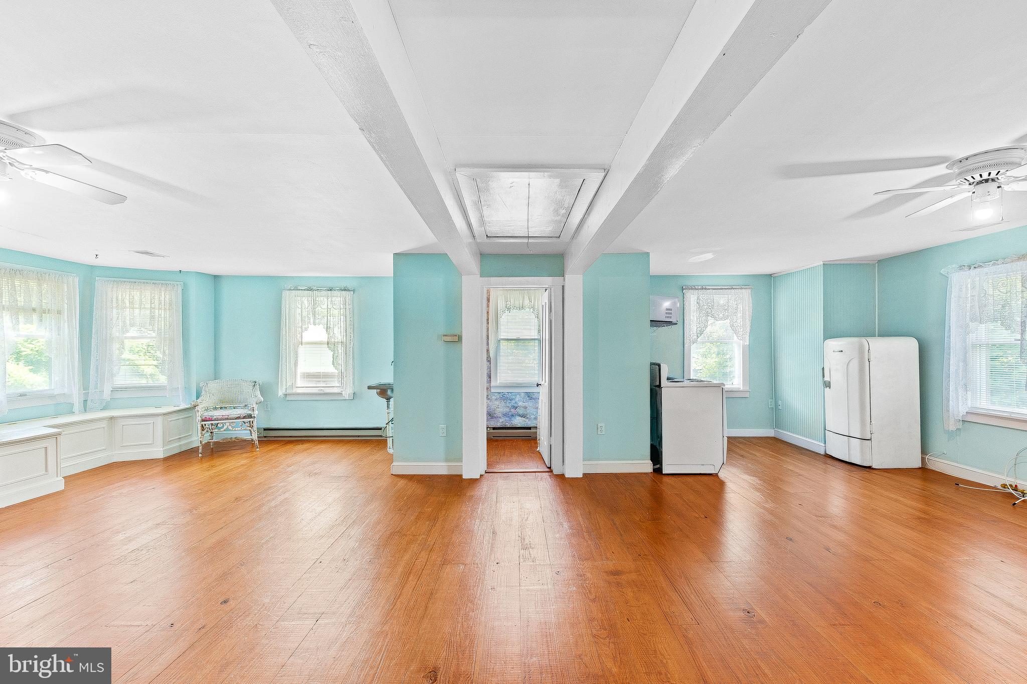 2440 Hallowing Point Road Prince Frederick, MD 20678 - Photo 21 of 51 a view of an empty room with window and wooden floor