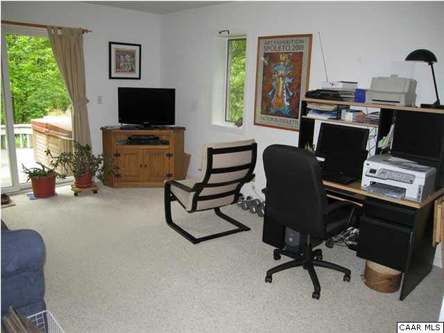 2864 Heartwood Road Afton, VA 22920 - Photo 13 of 21 a view of a workspace with furniture and a window