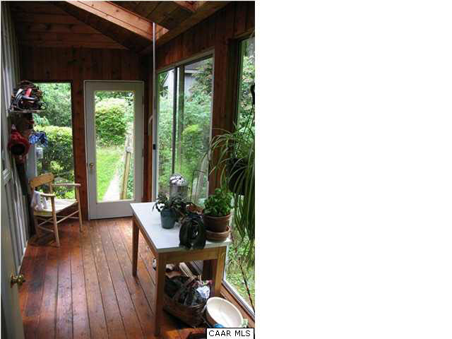 2864 Heartwood Road Afton, VA 22920 - Photo 10 of 21 a room with wooden floor and a porch