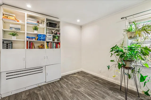 a workspace with furniture and a potted plant