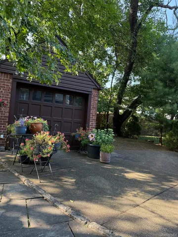 a view of a patio with chair and tables