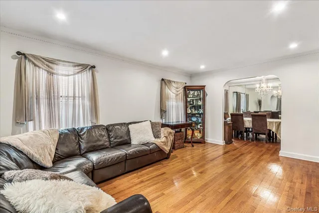 a living room with furniture and large window