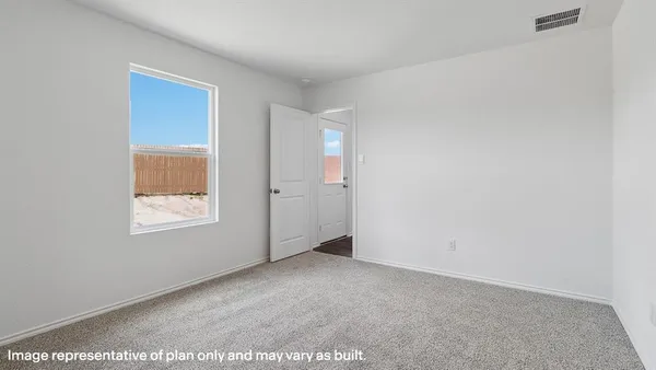 a view of an empty room and window