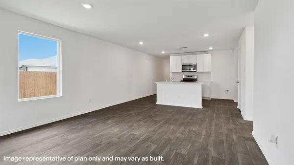 a view of a kitchen with a sink and microwave