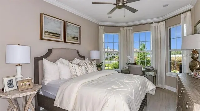 a bedroom with a bed and window