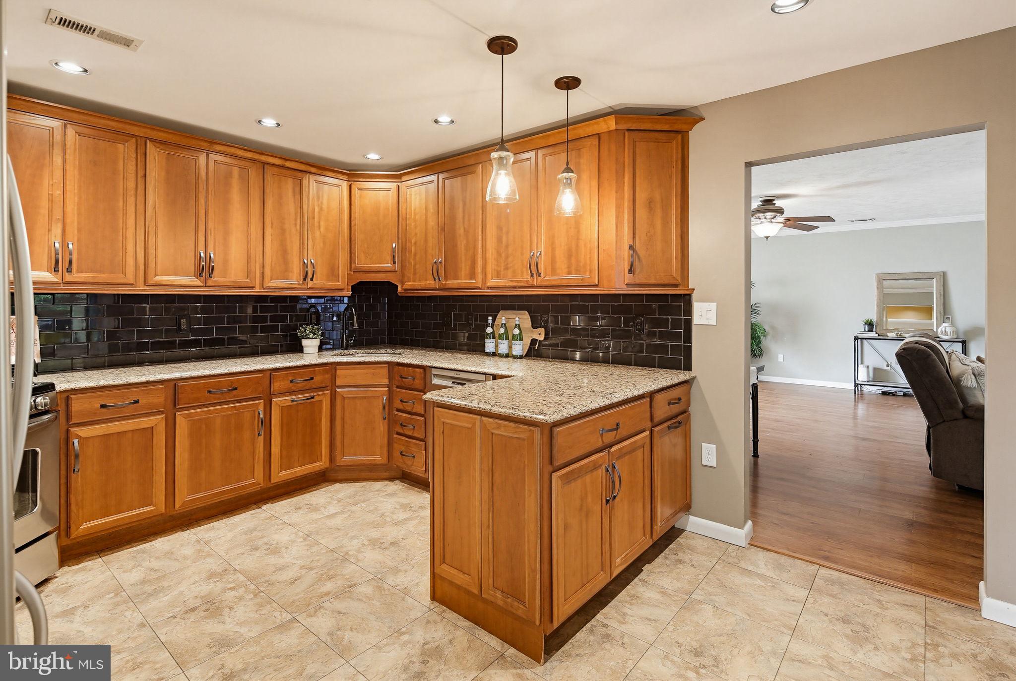 1124 Wynbrook Road Glen Burnie, MD 21060 - Photo 7 of 32 Warm wood tones in a modern kitchen.