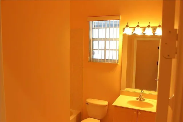 a bathroom with a sink and a toilet