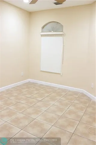 an empty room with a empty space and a window