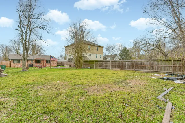 a backyard of a house with lots of green space
