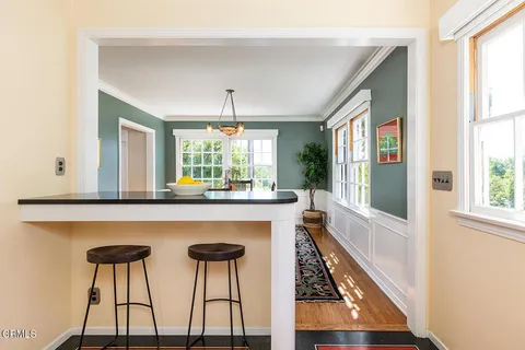 a dining room with furniture and window