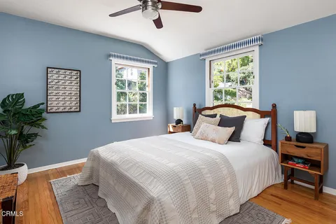 a bedroom with bed and window