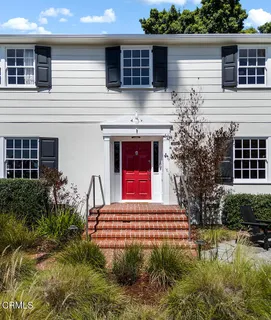 a house view with a garden space
