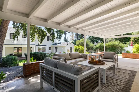 a living room with furniture and a yard