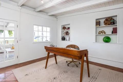 a living room with furniture and window