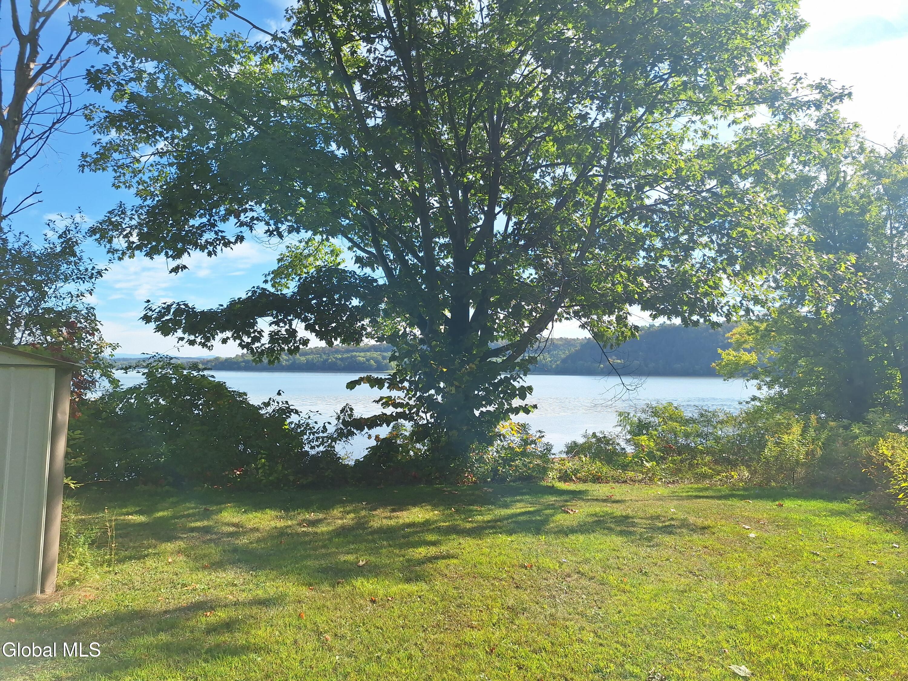 52 Wilson Bay Road Ticonderoga, NY 12883 - Photo 13 of 28 Side yard with a view